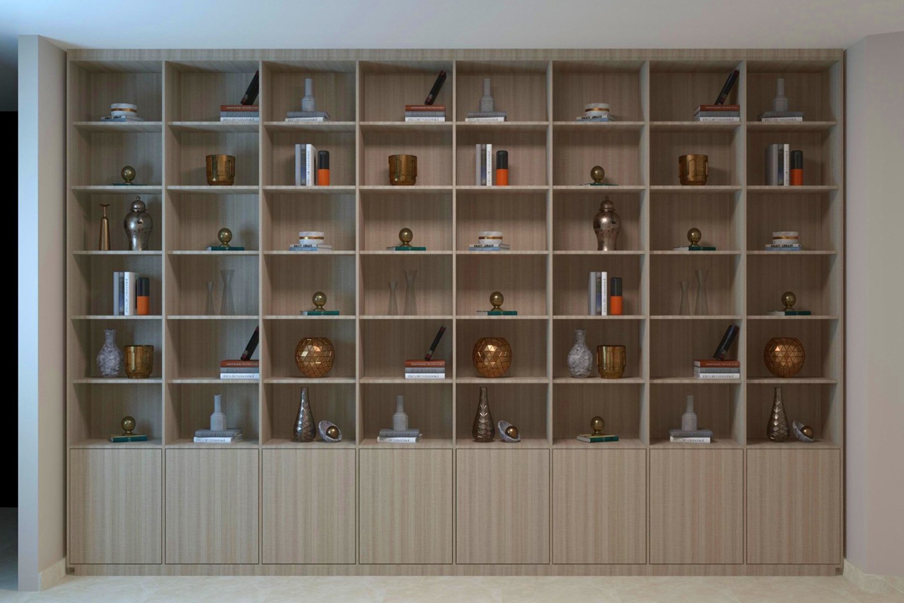 مكتبة خشبية مودرن بتصميم جداري كامل، تحتوي على وحدات رفوف مربعة مفتوحة مع ديكورات أنيقة وأبواب تخزين سفلية بلون خشب فاتح.